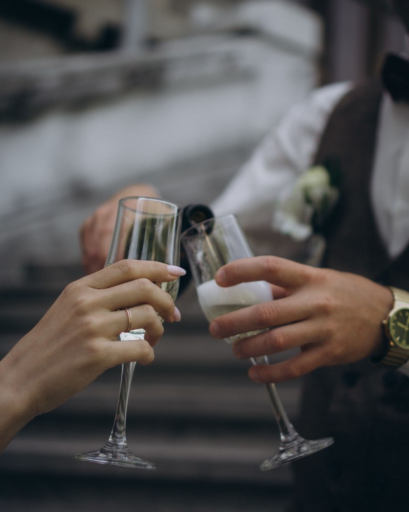 A bride and groom toasting with champagne glasses