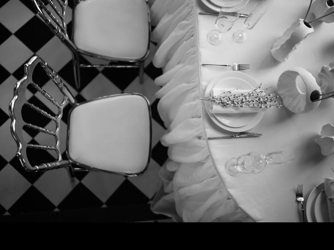 An elegant black-and-white styled reception table setting