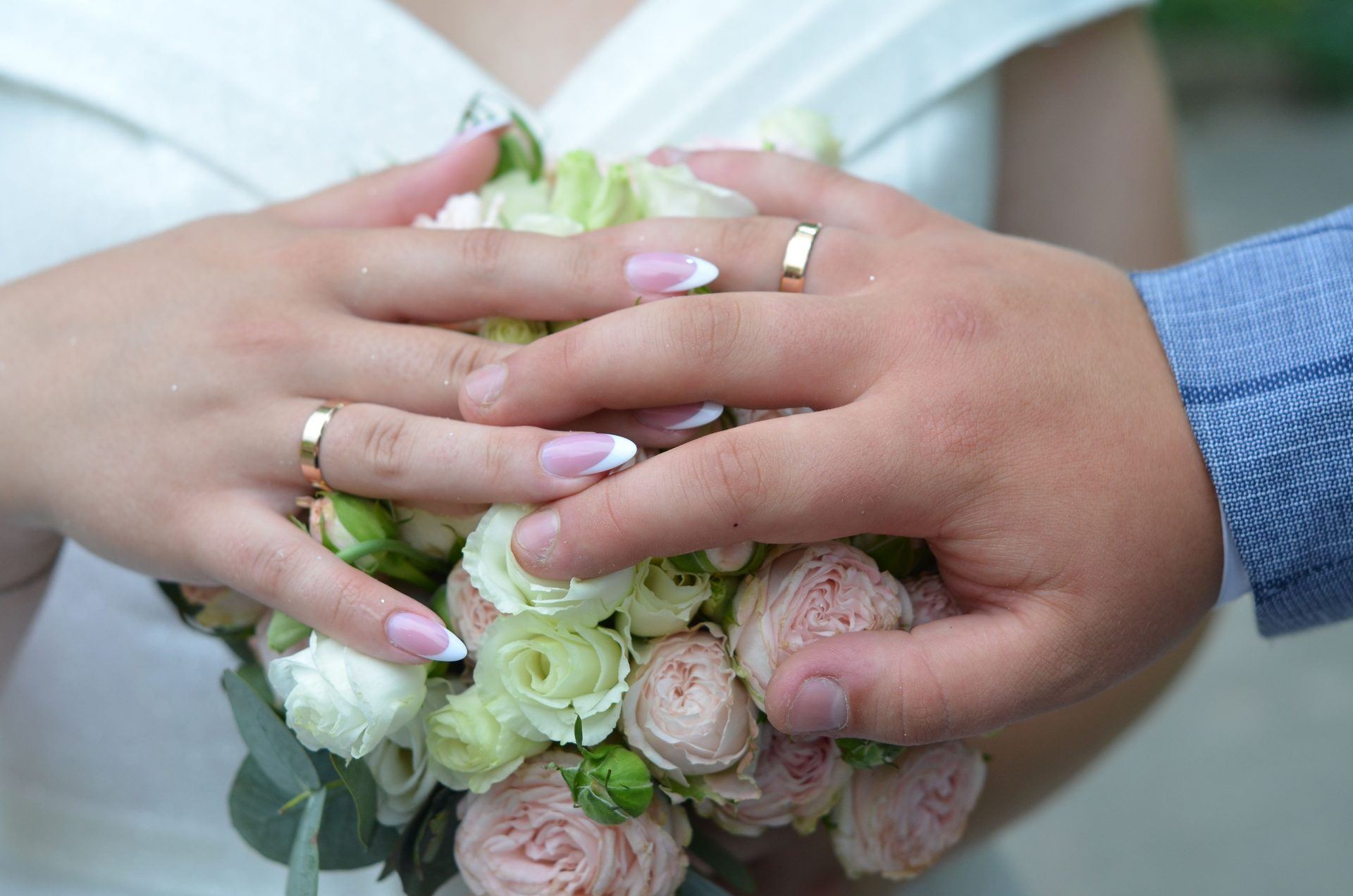 Wedding rings and a blush bouquet