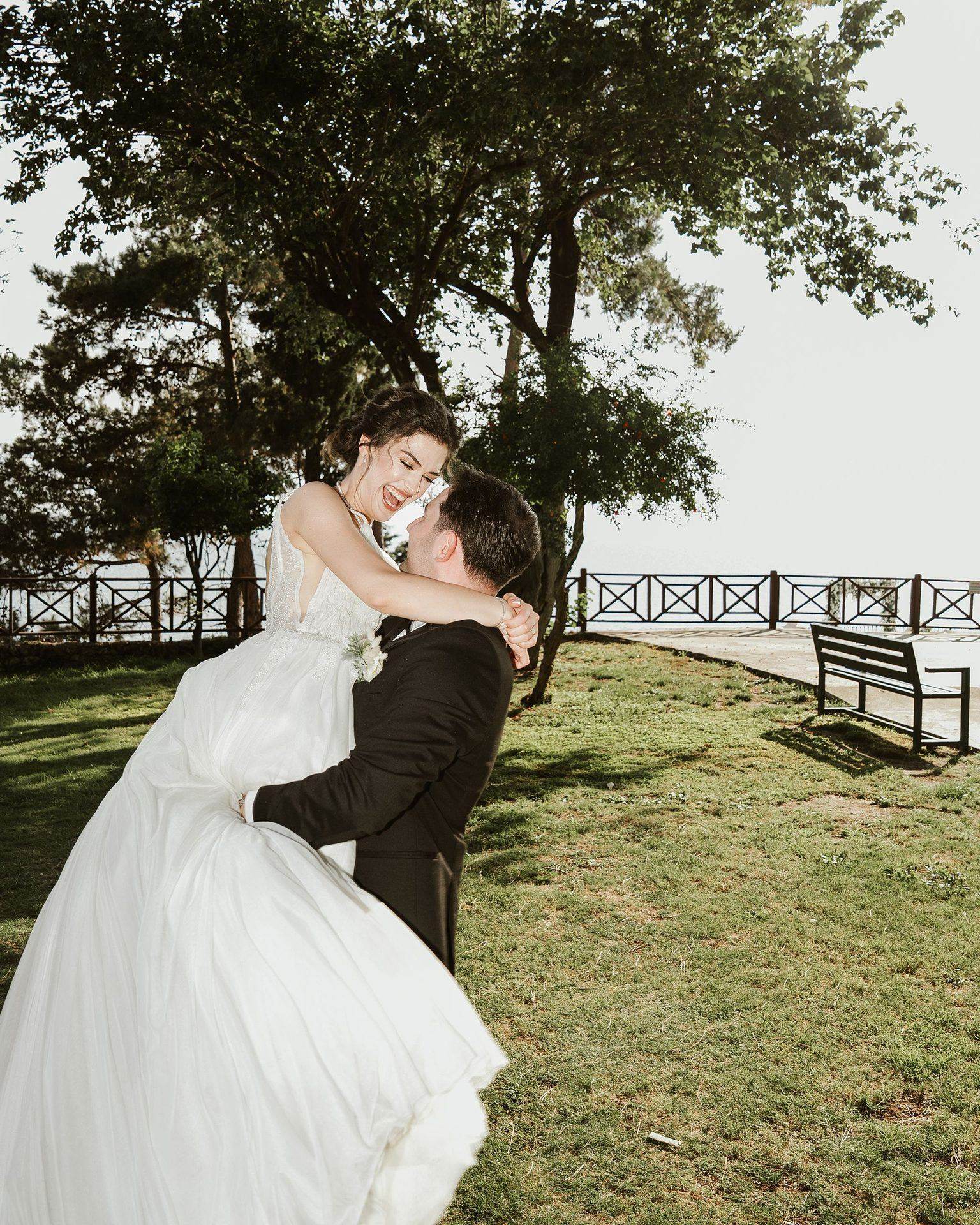 Newlywed couple embracing by the seaside in Georgia