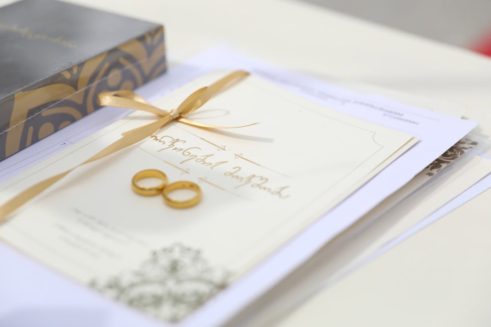 Signed marriage registration document with a pen