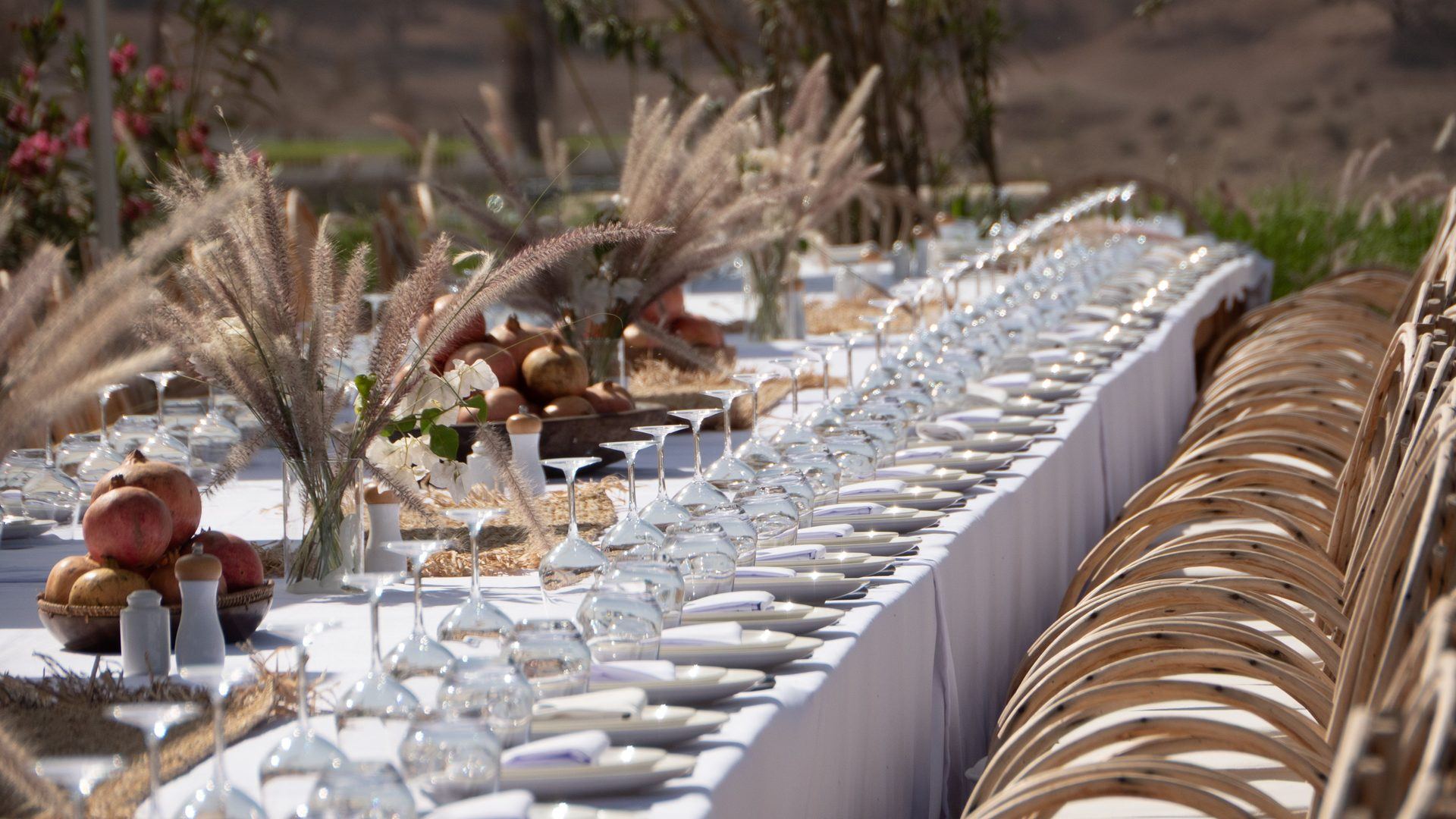 Reception table set with a floral centerpiece and glassware
