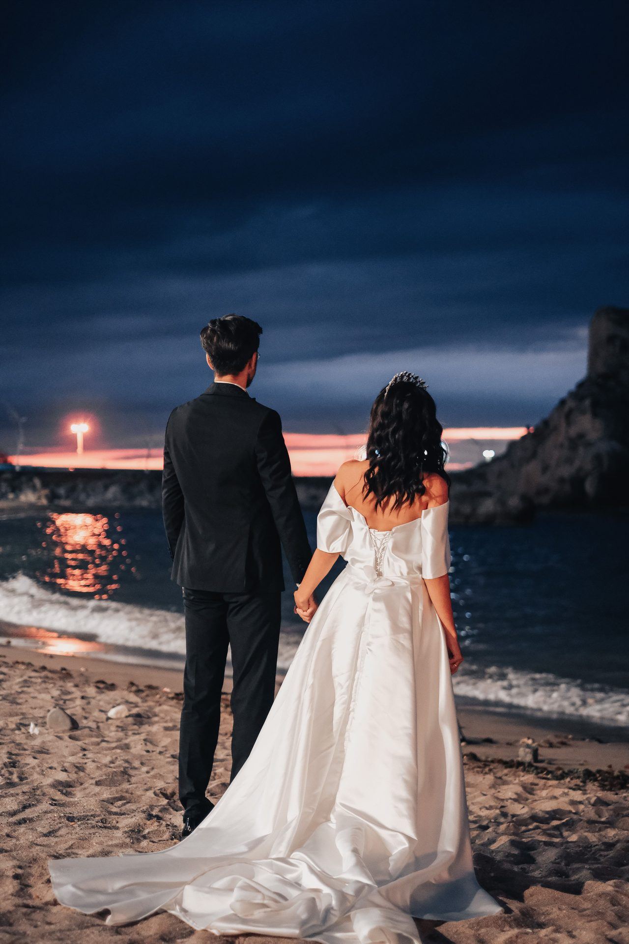 Couple at the seaside as evening falls